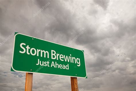 Storm Brewing Green Road Sign Over Storm Clouds Stock Photo By
