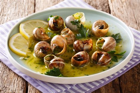 Delicatessen Food Edible Snails Escargot Cooked With Butter Parsley