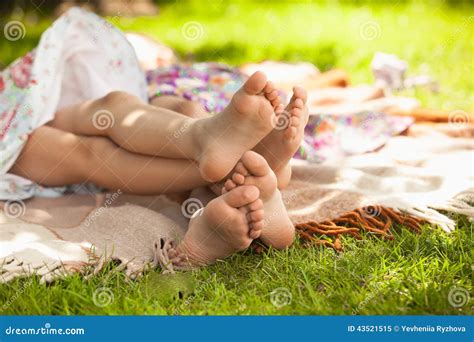 Photo Of Two Girls Feet Lying On Grass And Having Fun Royalty Free