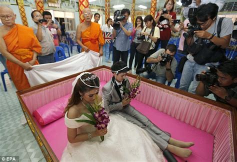 Thai Newlyweds Lie In A Coffin During Ceremony Meant To Bring Them Good