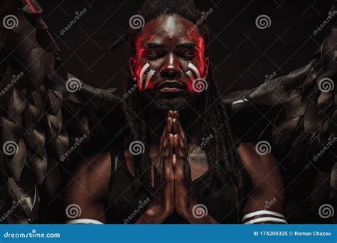 Serious Black Angel Pray With Closed Eyes Stock Image Image Of Light