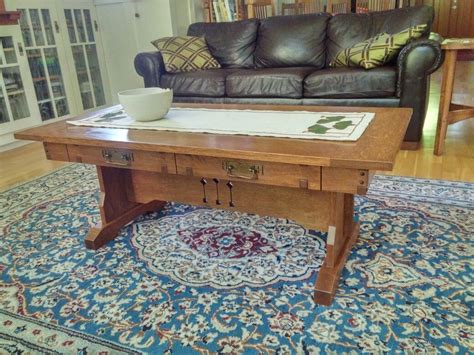 42cm (h) x 108cm (w) x 59cm (d). Quarter sawn white oak and Ebony coffee table. This coffee ...