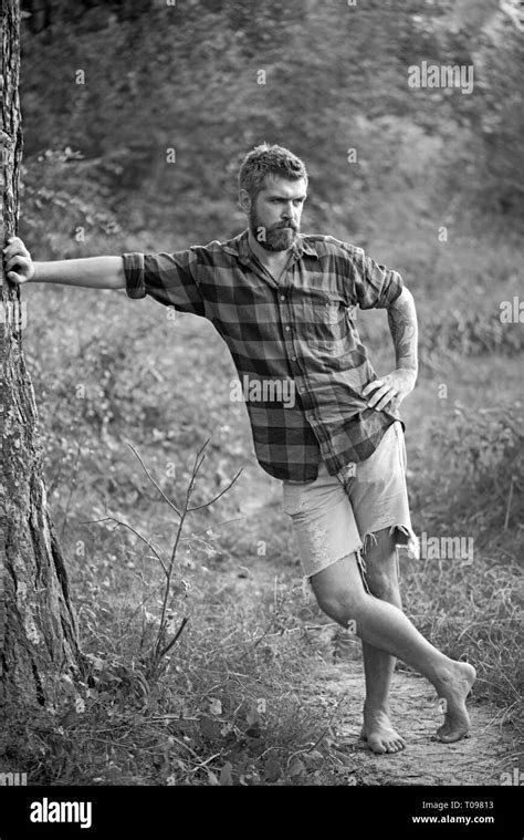 Tall Big Man Standing Barefoot On Path Hipster Hiking In Woods Summer