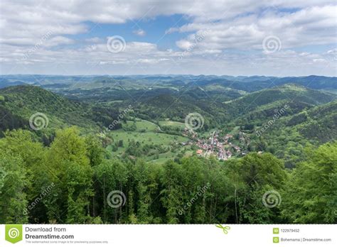 Mountain Forest Landscape Under The Blue Sky With Clouds