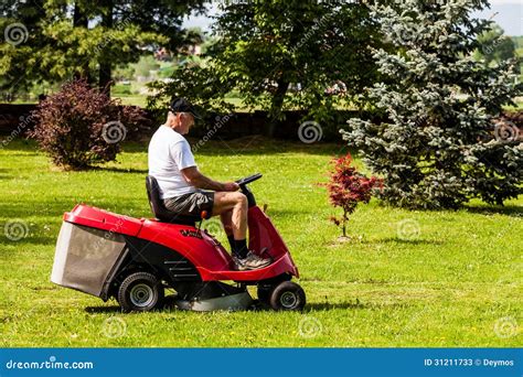 Senior Man Driving A Red Lawn Mower Stock Photos Image 31211733