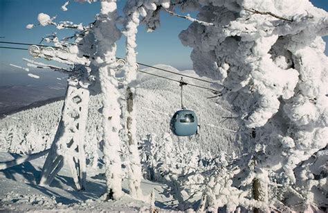 A Gondola From Sugarbush Resort Takes Skiers To The Top Of A Peak In