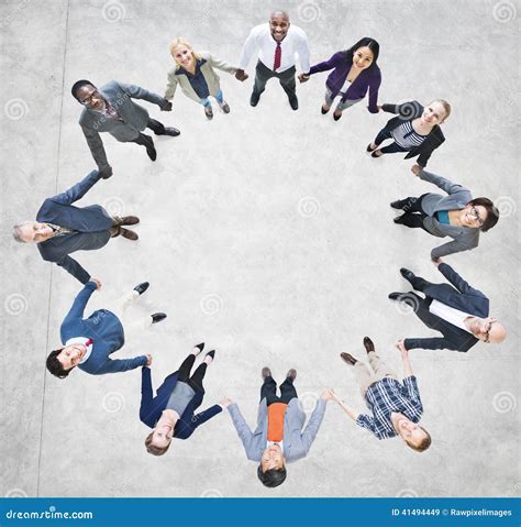 Cheerful Business People Holding Hands Forming A Circle Stock Image