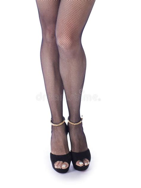 Female Legs In High Heel Black Shoes And Fishnet Stockings Retro Style