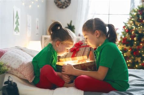 Children Opening Christmas Presents Stock Image Image Of Present