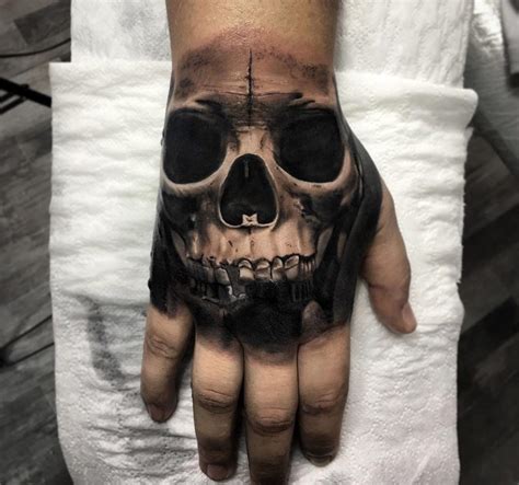 Skull Hand Tattoos Designs Ideas And Meaning Tattoos For You