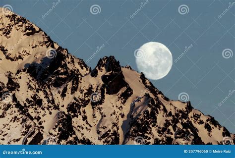 Full Moon Over Snowy Mountain Stock Photo Image Of Scenic Evening