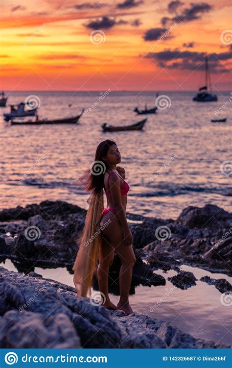 Asian Girl Posing On The Rocks At Sunset Stock Image Image Of Dusk Light