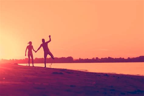 Premium Photo Naked Man And A Woman Running On The Beach At Sunset