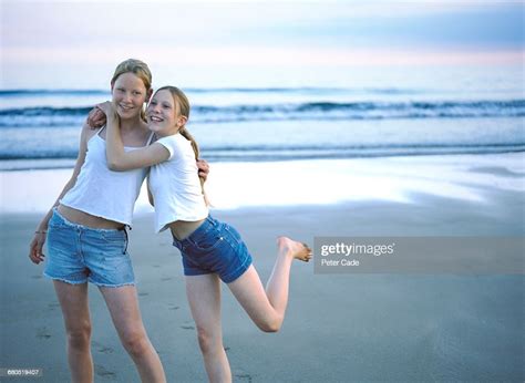 Two Young Girls On Beach Photo Getty Images