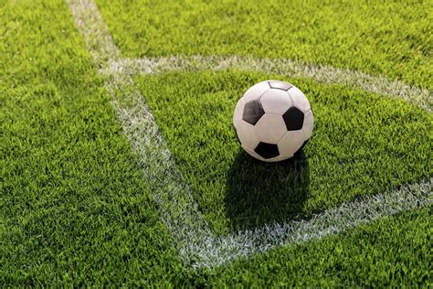 Soccer Ball On Grass In Corner Kick Position On Soccer Field Stadium
