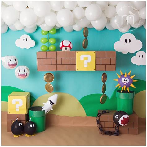 A Super Mario Birthday Party With Balloons And Decorations On The Wall