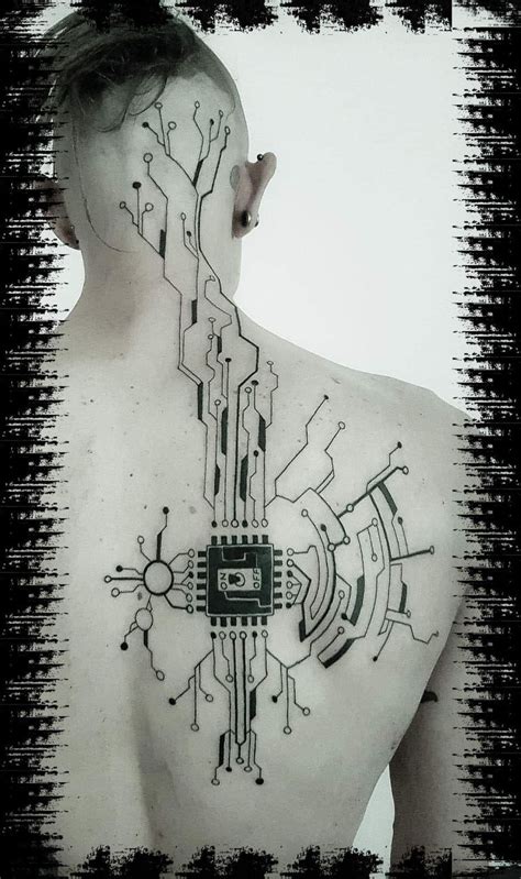 A Mans Back With An Electronic Circuit Board Tattoo On His Upper Body