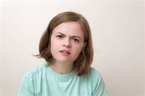 Portrait Of Young Caucasian Woman Girl With Confused Annoyed