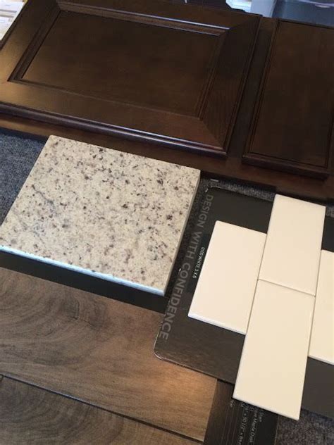 The contrast between white and dark wood complement one another. espresso cabinets, moonlight granite, white subway tile ...