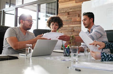 Portrait Of Young Office Workers Meeting In A Boardroom Team Of