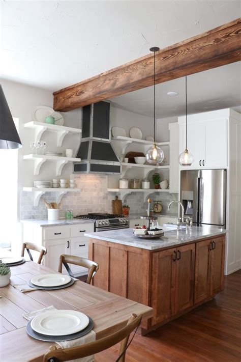 Explore these 20 beautiful examples of some things will never budge from our dream home wish lists: White Eat-In Kitchen With Exposed Wood Ceiling Beam | HGTV