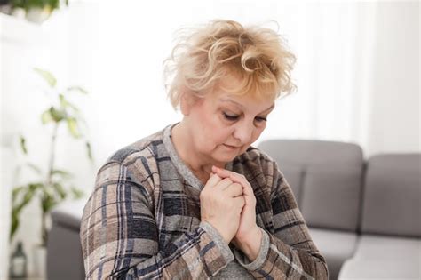 premium photo religious faithful middle aged woman praying with hope faith holding hands