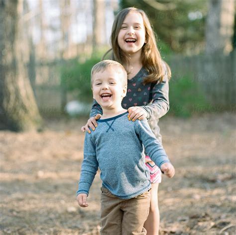 Brother And Sister Being Funny And Laughing Together By Jakob Lagerstedt