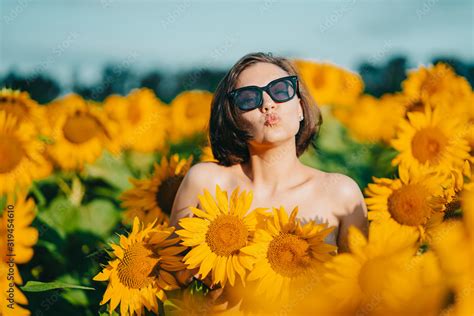 Funny Portrait Of Nude Woman With Sunflowers On Her Chest Cheerful