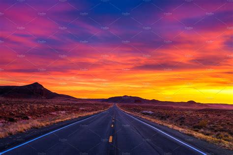 Dramatic Sunset Over An Empty Road In Utah Nature Stock Photos