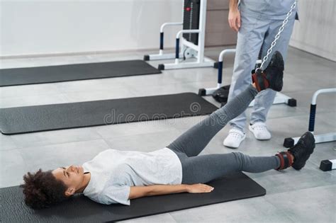 Woman Doing Leg Exercise In The Gym Stock Photo Image Of Activewear