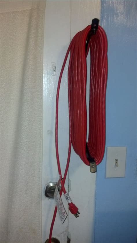 Easy Way To Store Long Extension Cords Take 2 L Brackets And Put Them