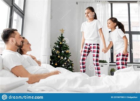 Happy Children Wake Their Parents On Christmas Stock Image Image Of