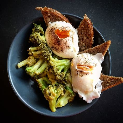 Healthy Breakfast Woth Poached Eggs Toasted Rye Bread And Lemony