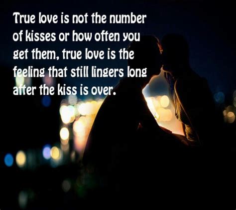 A Man And Woman Kissing In The Dark With Text That Reads True Love Is