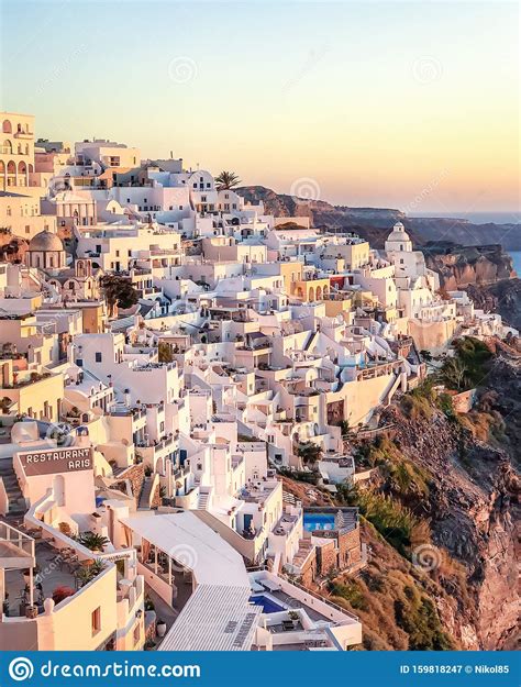 Sunset View Of Traditional Greek Village Oia On Santorini Island In