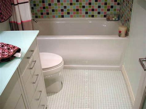 The pale green tiles used in this simple bathroom from at home in love are just glossy enough to create the feel of a larger bathroom without looking dated. 20 Best bathroom flooring ideas