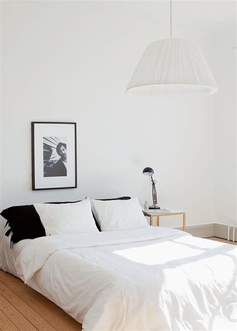 Here's another brilliant example of a minimalist bedroom that's still filled with the right kind of necessities. Minimal Bedrooms - Homey Oh My