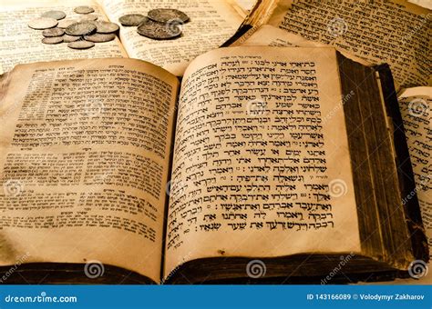Open Talmud Torah Tanakh Book On Black Background With Spectacles