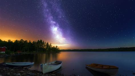 Peaceful Lake Boats Wooden House Forest Sky With Stars