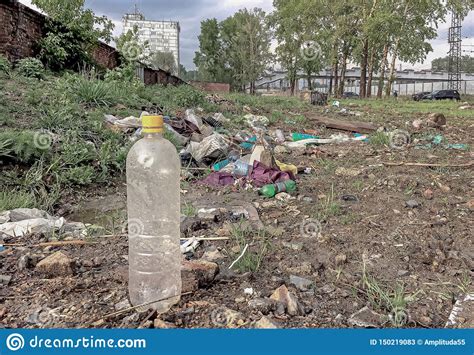 Plastic Bottle Amid Debris Pollution Landfill In The Open Area Stock