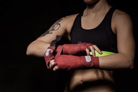 Close Up Of A Woman Wrapping Hands With Red Boxing Wraps Stock Photo