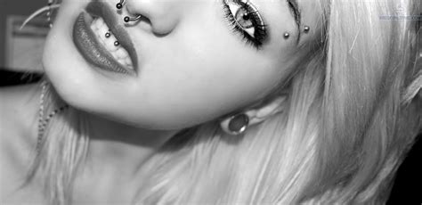 Girl With Lower Lip And Tongue Web Mouth Piercing