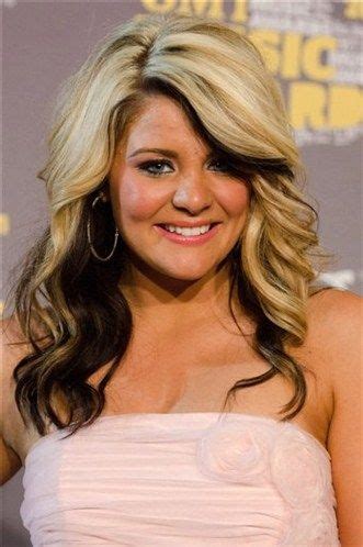 This dark hair is almost black, making it easy to go bold and striking with caramel blonde balayage around the face and towards the ends. blonde with dark underneath hairstyles | Country music's ...