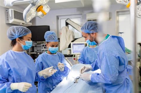 Premium Photo Surgery Operation Group Of Surgeons In Operating Room