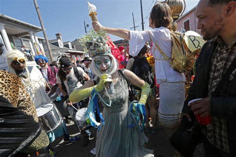 new orleans revelers celebrate mardi gras