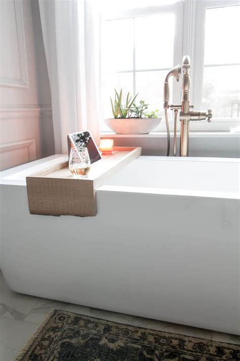 You can make this bath tray with a book holder using basic diy skills and for about $20. DIY Bathtub Tray with Reclaimed Wood