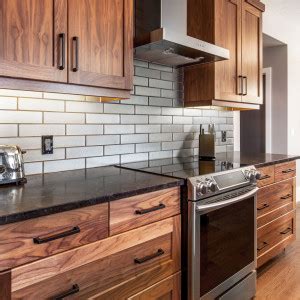 You are going to need a person to help you lifting cabinets onto your wall. Black Walnut Natural | Superior Cabinets