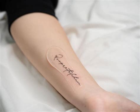 Roopretelcham Lettering Tattoo On The Inner Forearm