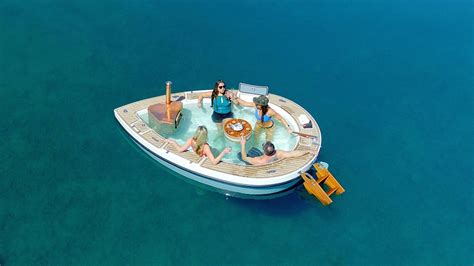 Meet The Spacruzzi A Bonkers Hot Tub Boat With Its Own Fireplace Robb Report Cleaning Hot Tub