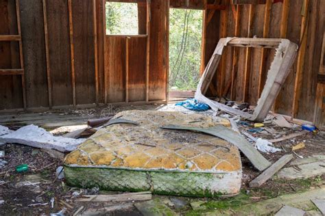 Mattress And Broken Bed Frame In An Abandoned Shack Stock Photo Image